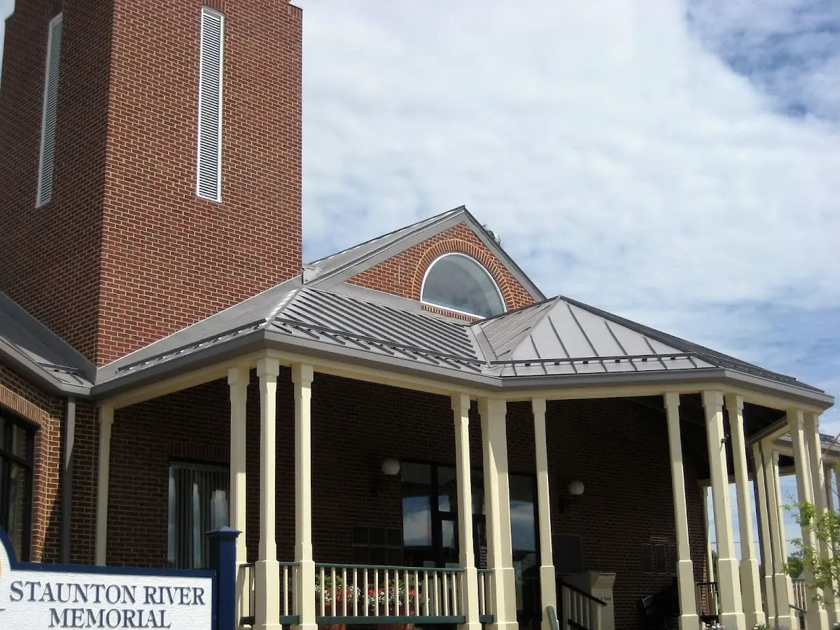 Skilled roofing craftsmen working on a residential roof in Harmony Hall